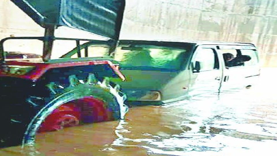School van stuck in waterlogging in underpass in agra