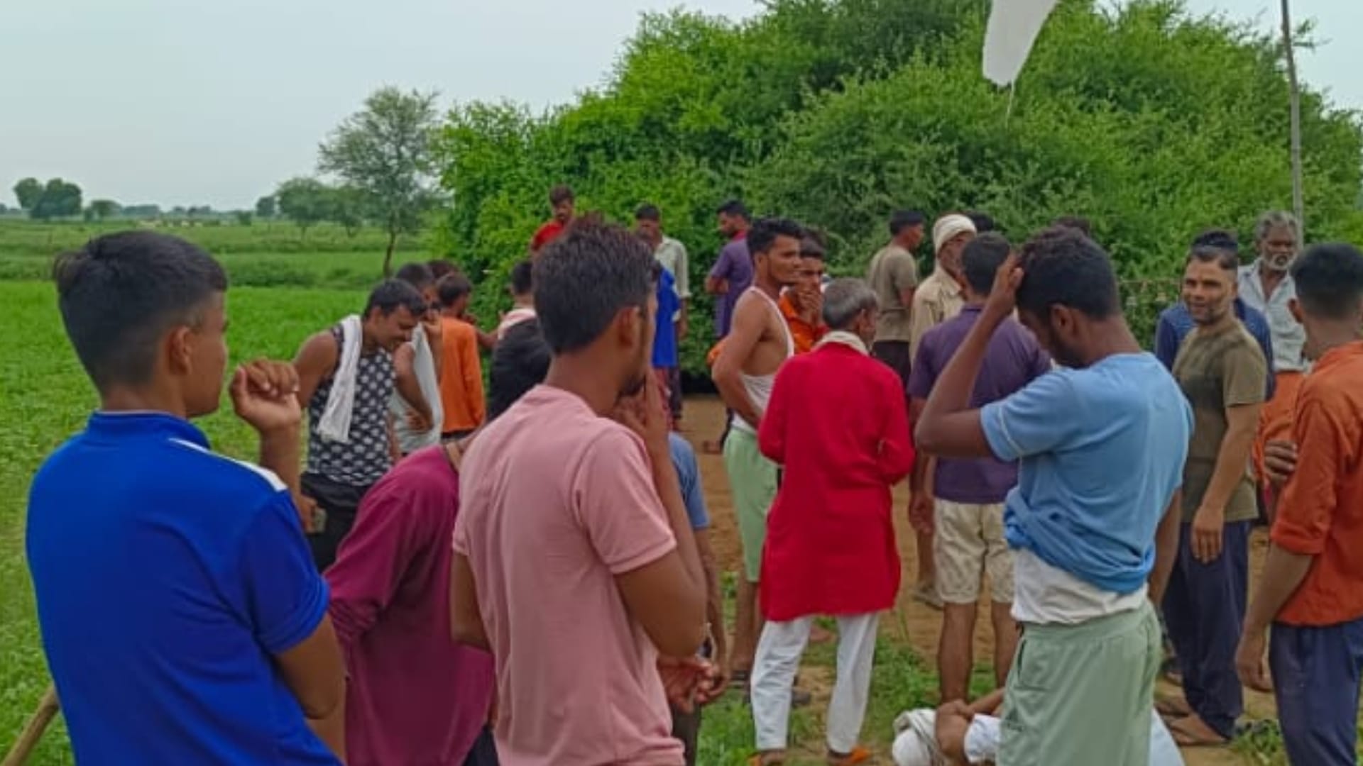 crowd of people gathering of treasure hidden inside the ground in Chambal area.