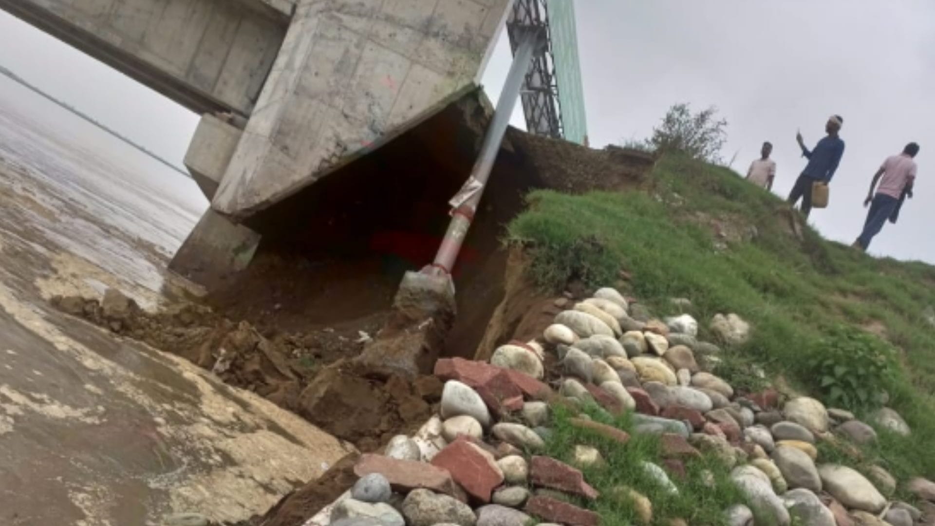 There is a danger on the bridge and a large part of the road has been washed away in the Ganges see photos