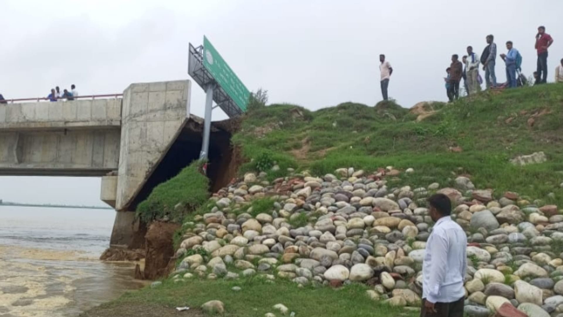 There is a danger on the bridge and a large part of the road has been washed away in the Ganges see photos