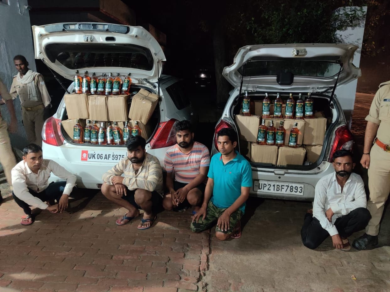 1078 bottles of English liquor recovered from two cars