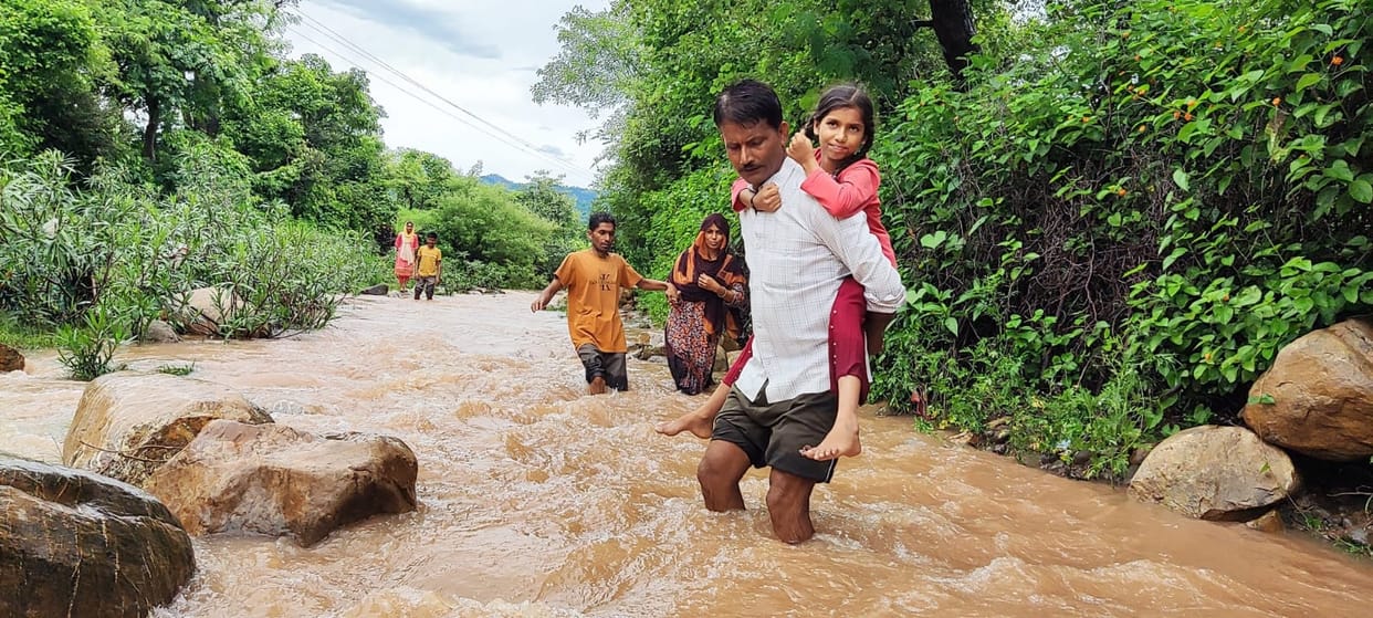 Putting their lives at risk, cross the Pudkala drain