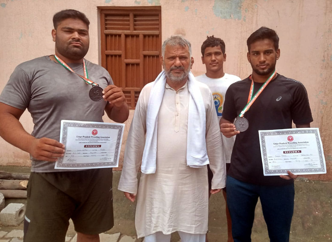 Wrestlers who came after winning medals received a warm welcome