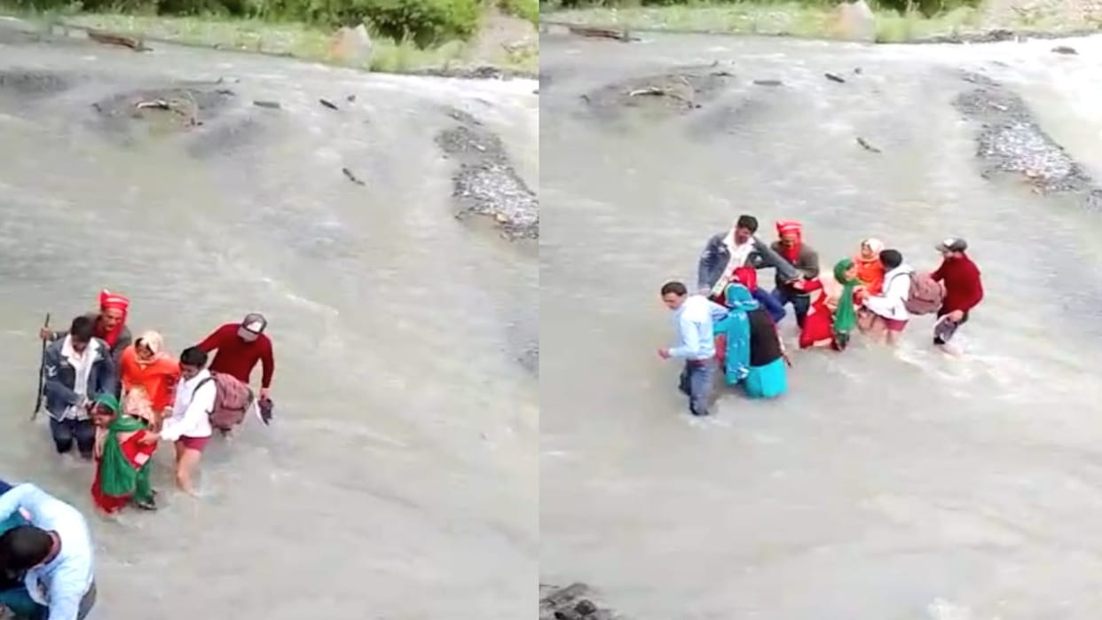 The bride and groom had to cross the overflowing nala after getting married