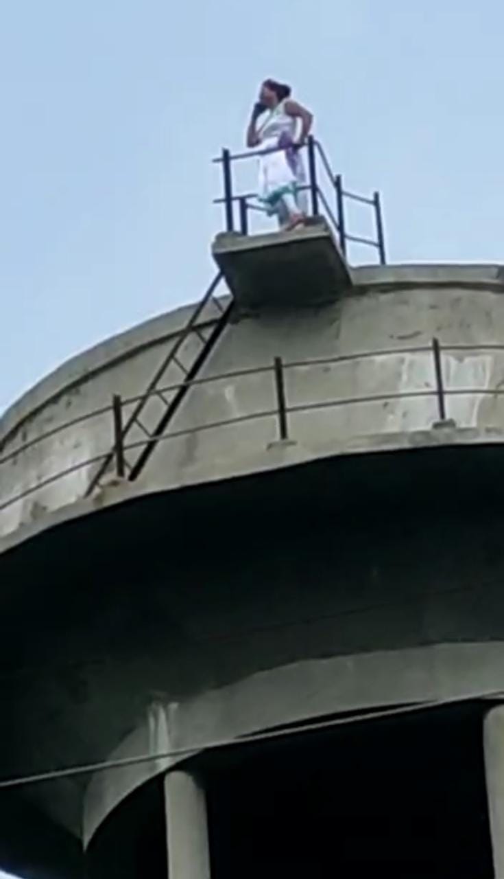 Hathras: A woman troubled by an officer-clerk climbed on the water tank in the collectorate