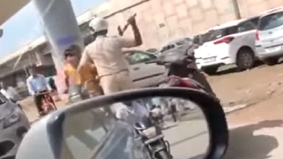 Seeing the policeman coming with an ax, the bike rider escaped