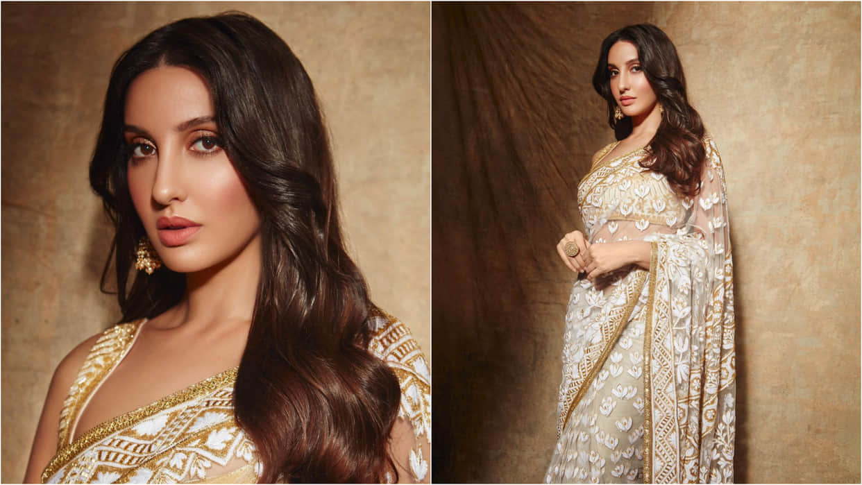 nora fatehi look stunning in ivory manish malhotra sheer fabric saree