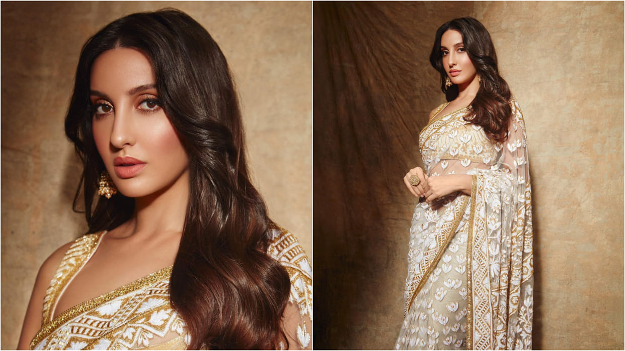 nora fatehi look stunning in ivory manish malhotra sheer fabric saree