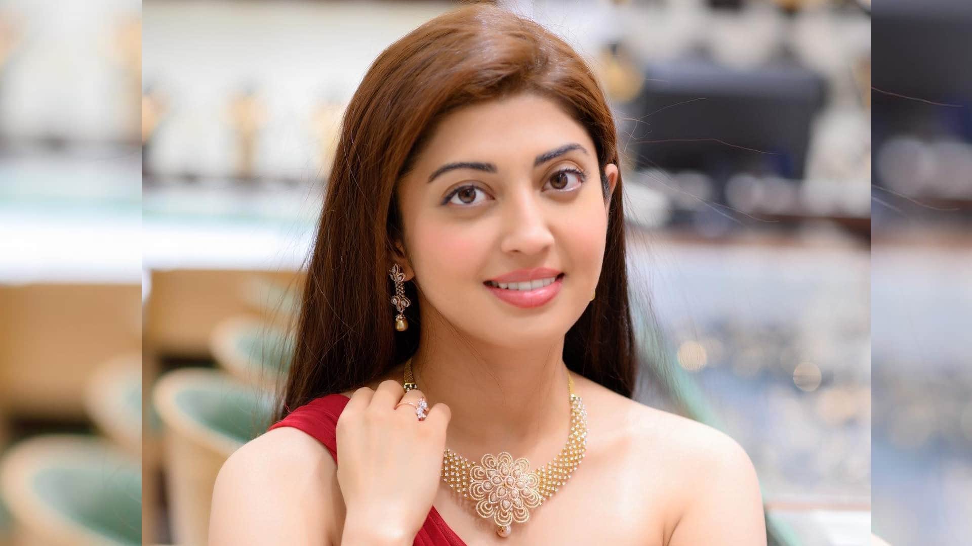 actress pranitha subhash reacts trolls criticising her photo sitting near husband feet for bheemana amavasya