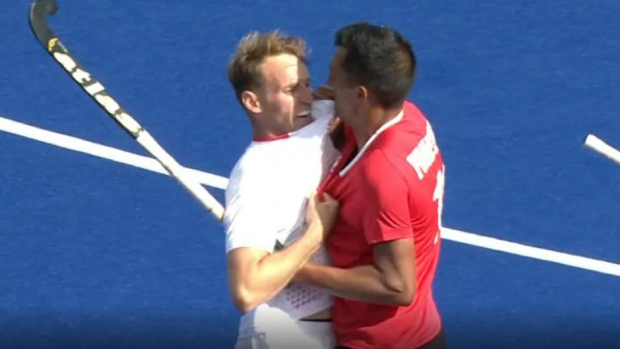 Balraj Panesar and chris griffith clash in England vs Canada Hockey match