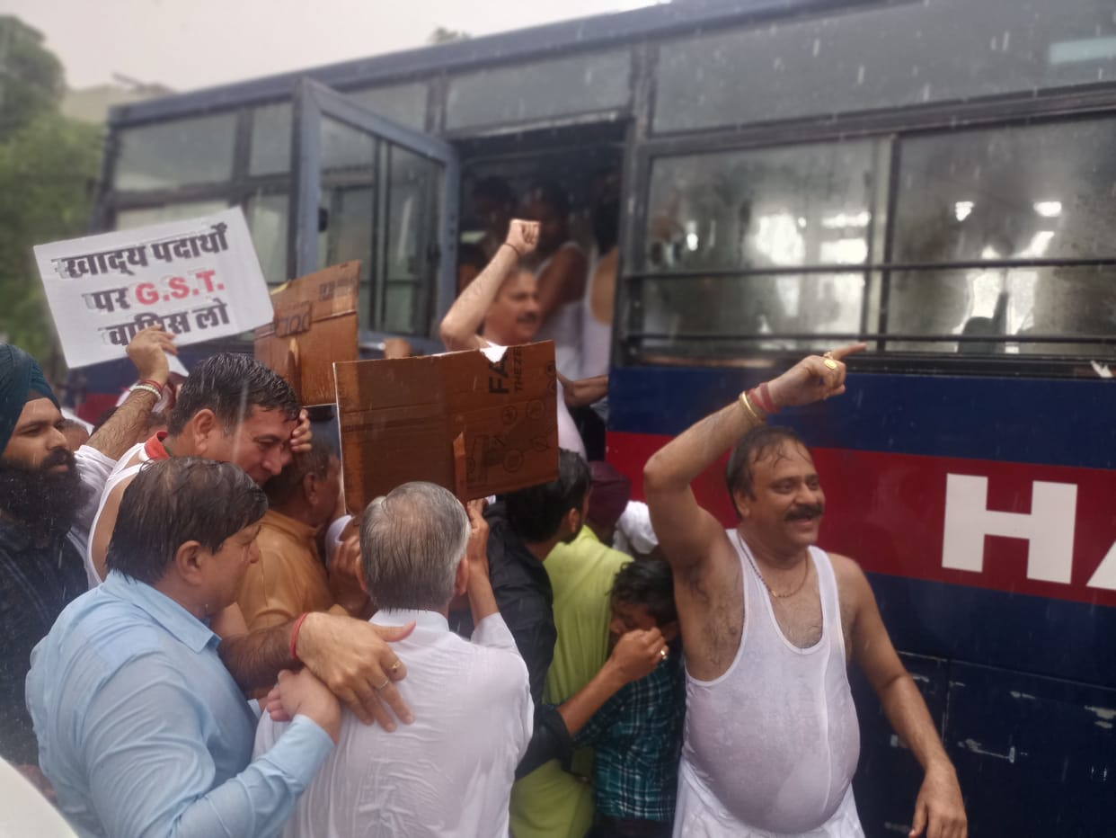 Congressmen protest semi-naked in rain against unbridled price rise