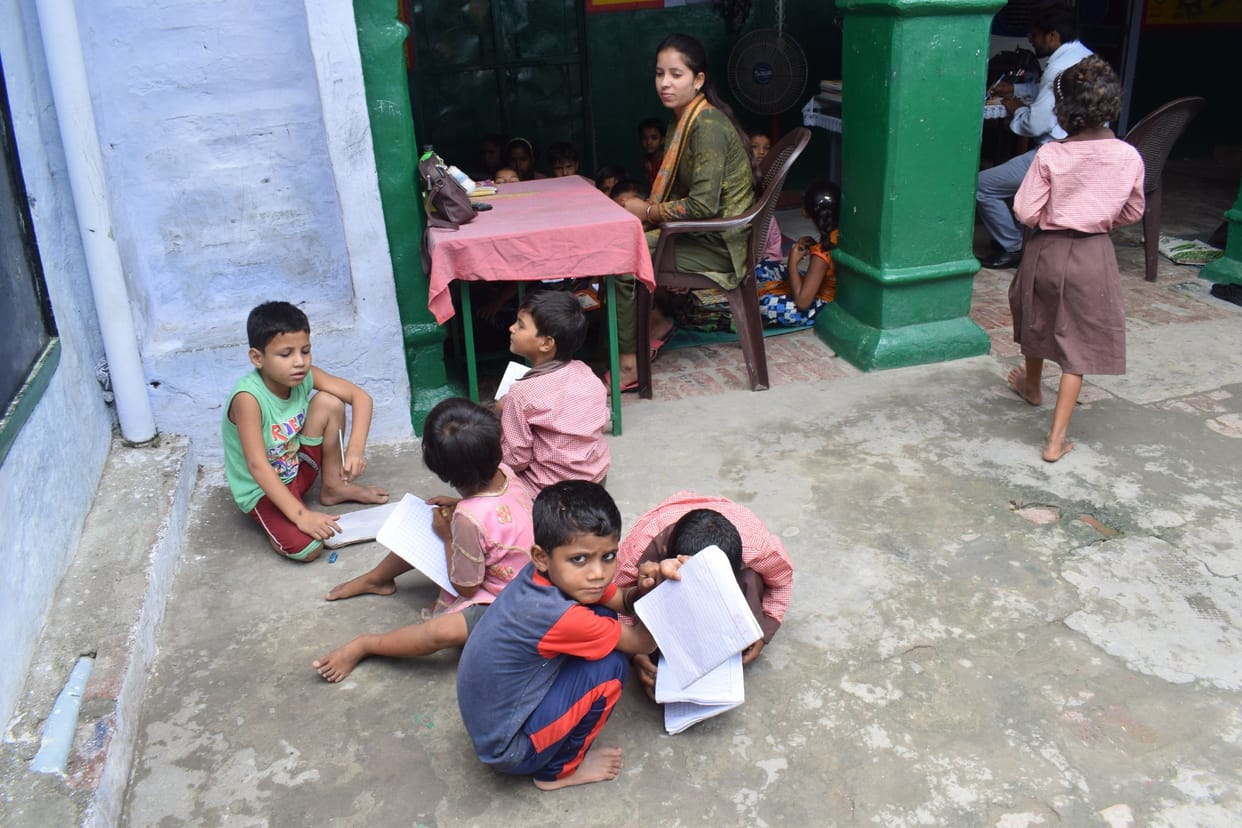 children reading from old books