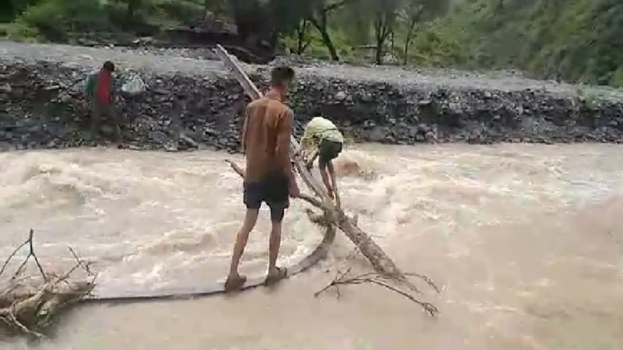 Rahul reached school on the seventh day after crossing the flooded khadd with a rope tied around his waist