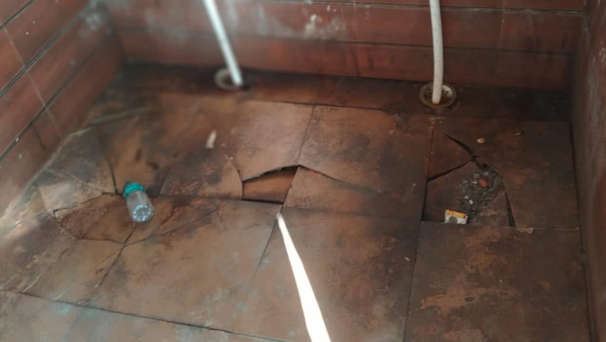 Broken commode and floor, yet Mahanagar ODF plus-plus