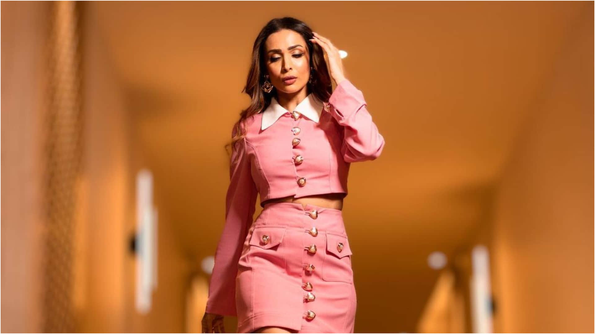 malaika arora pink crop top and mini skirt worth 19k looking super stylish