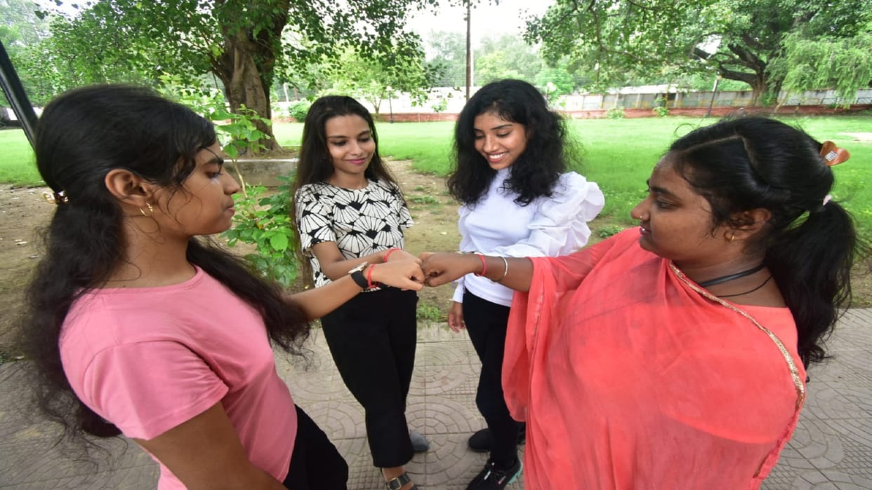 Friendship day celebrated by tying friendship band