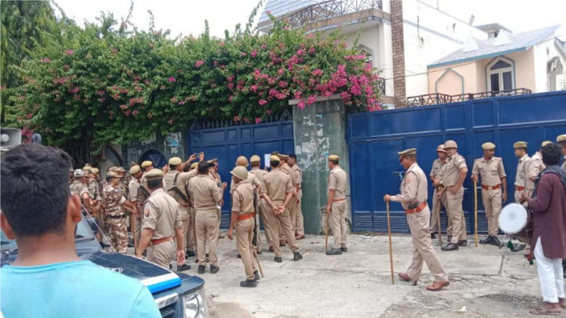 Police pasted non-bailable warrants at the house of former MLC Haji Iqbal and his brother-in-law