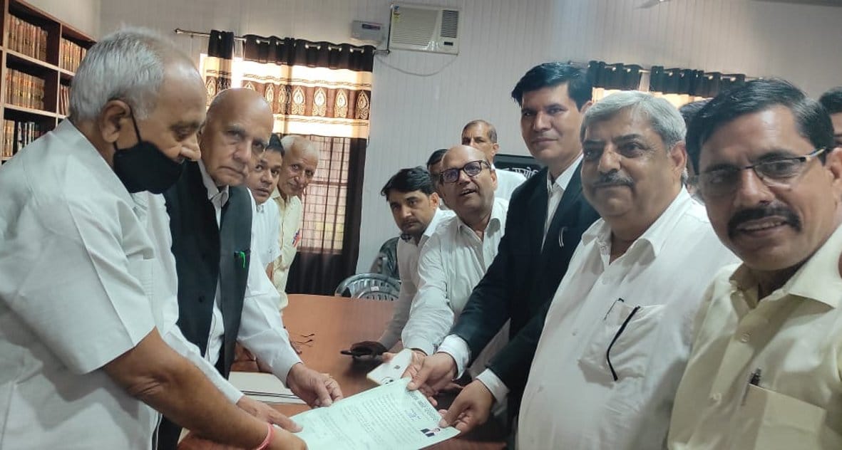 There will be a triangular contest in the election of the District Bar Association