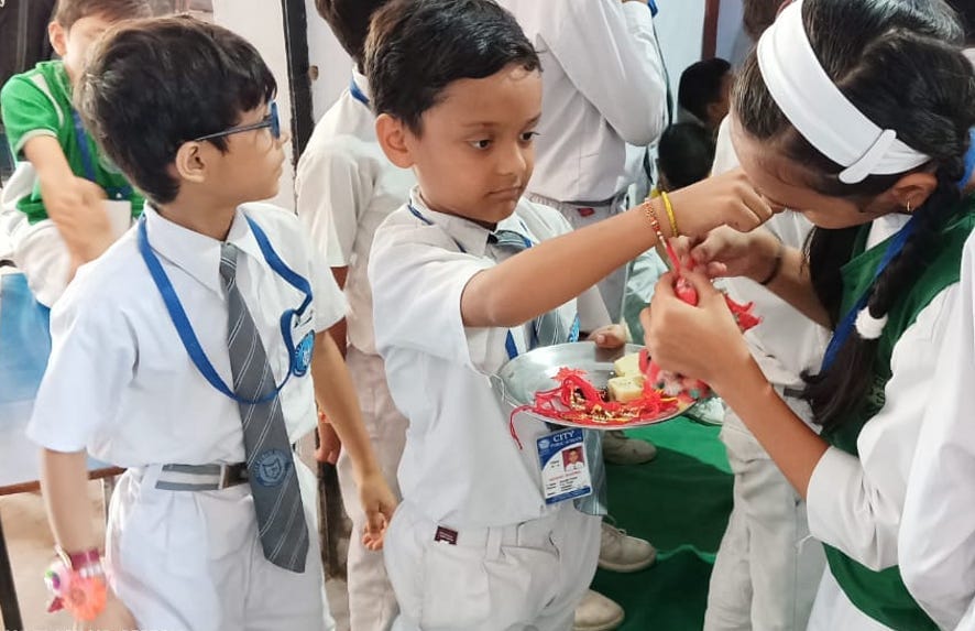 Sisters tied rakhi in schools