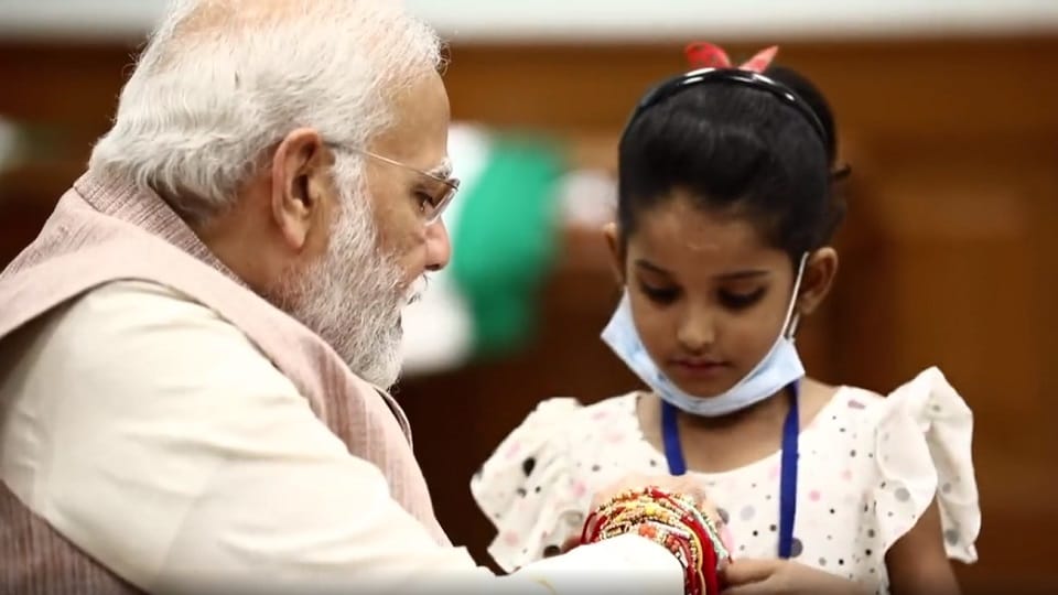 PM Modi Raksha Bandhan with daughters of sweepers, peons, others working at PMO
