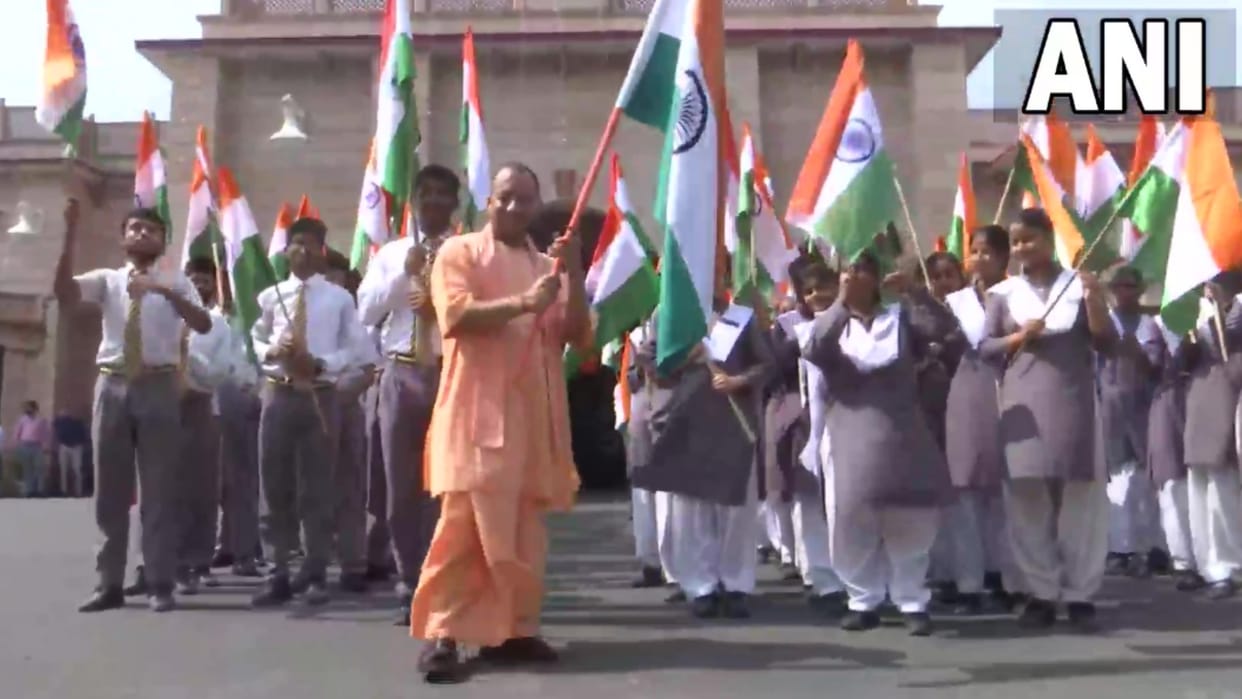 CM Yogi Adityanath flags off Har Ghar Tiranga campaign, along with school children.
