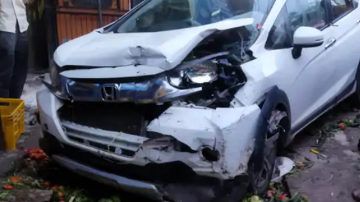 drunk driver hit and injured the passenger auto and woman selling vegetable