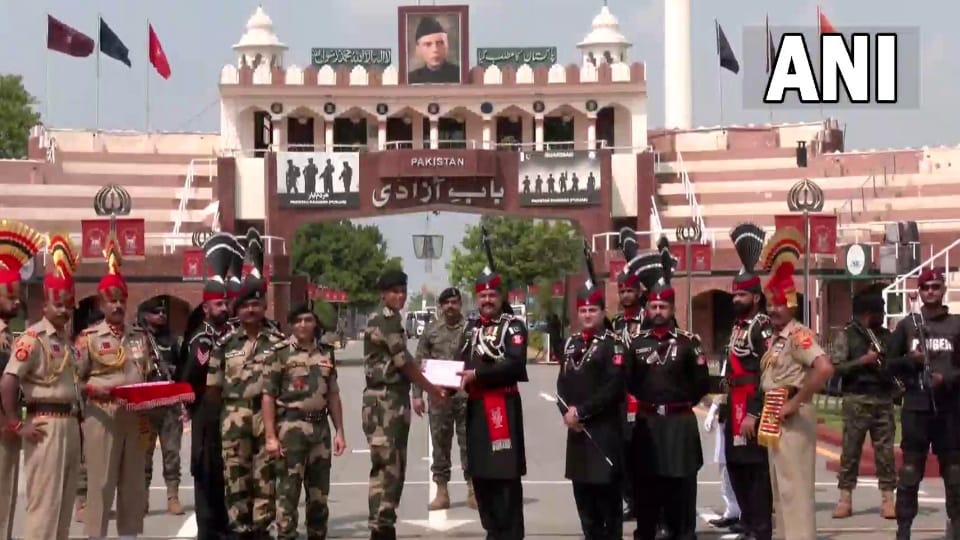 Pakistan Rangers and BSF exchange sweets at Attari-Wagah border on occasion of Pakistan Independence Day