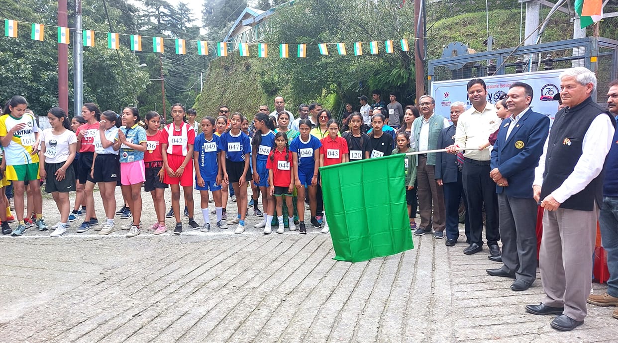 Children run under the nectar festival of independence