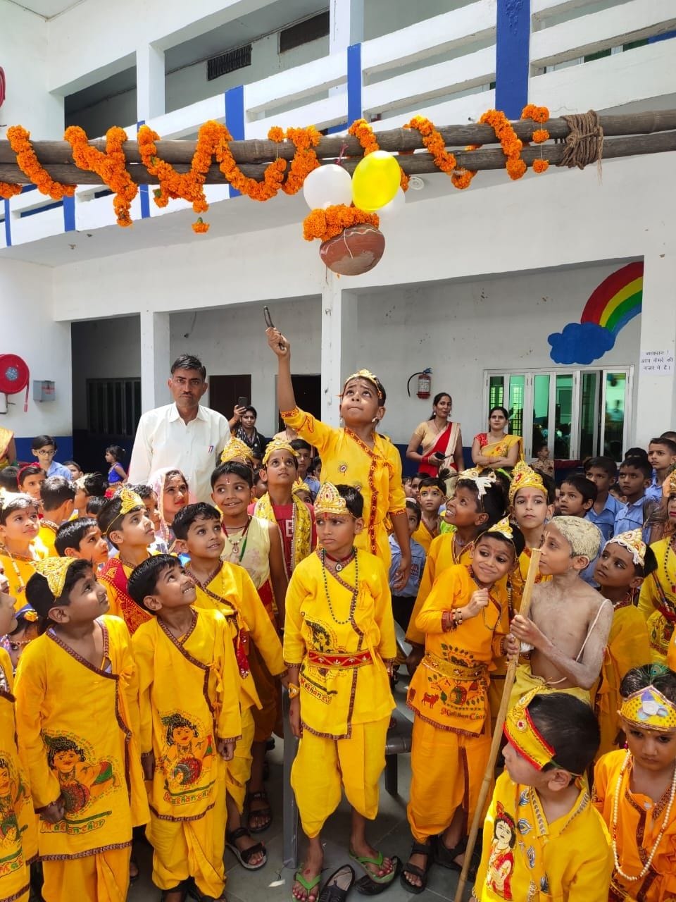 Breaking the dahi handi and assuming the form of Shri Radha-Krishna