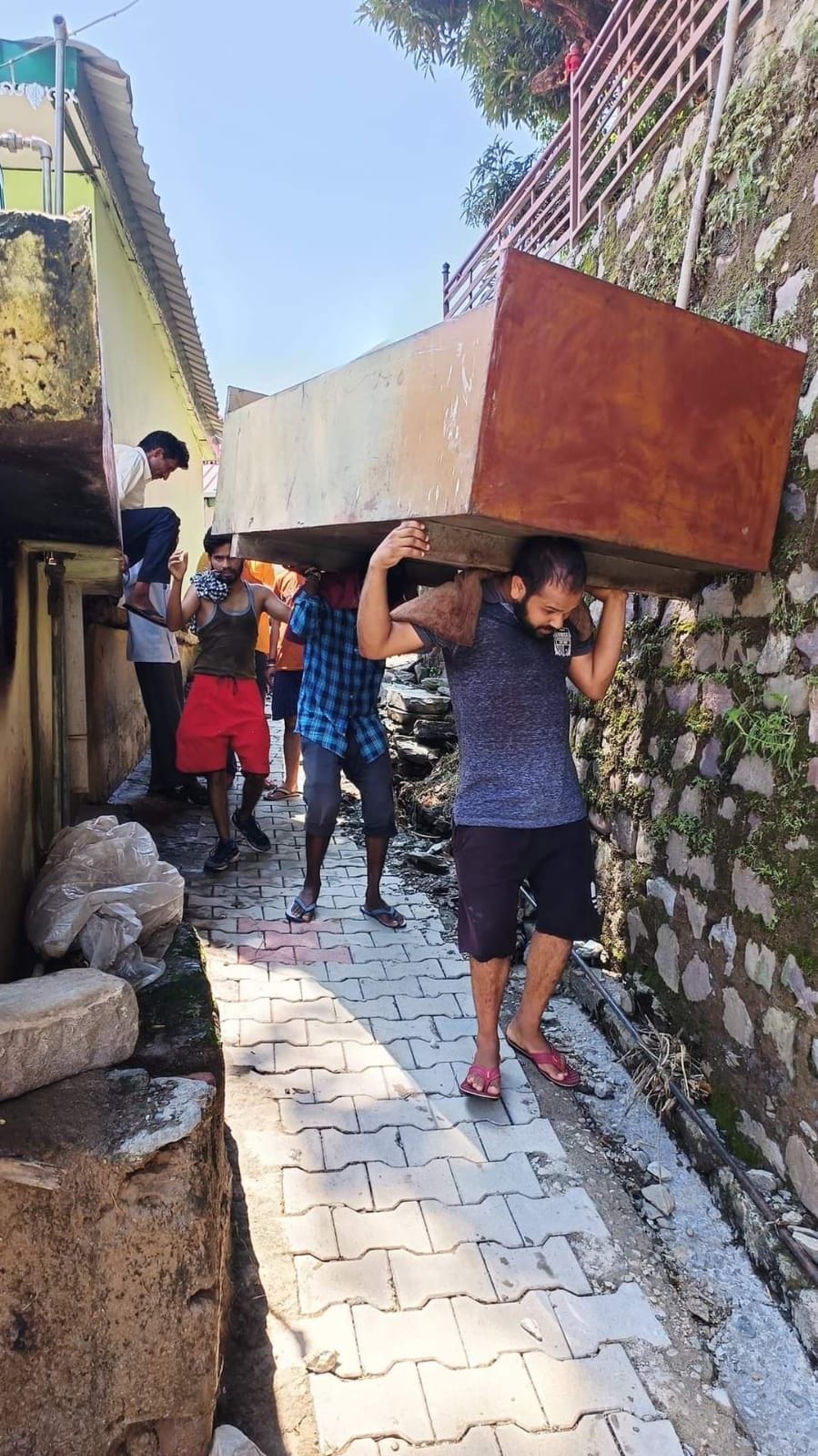 School children looking for books and toys in the rubble