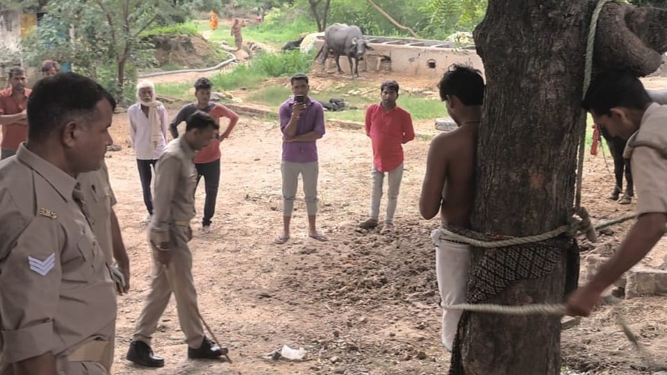 woman's family members beat the her boyfriend by tying to tree in firozabad