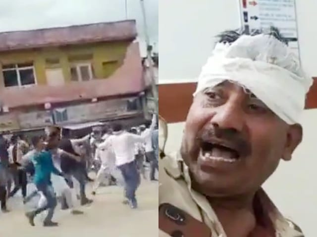 प्रदर्शन करते हुए लोग और घायल पुलिसकर्मी