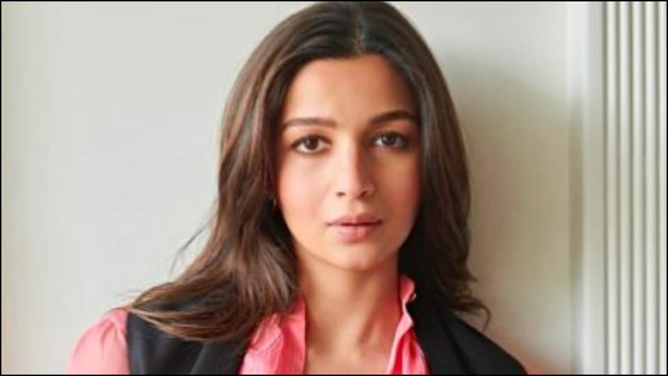 Mother to be Brahmastra star Alia Bhatt flaunts her baby bump in a pink dress fans praise the actress