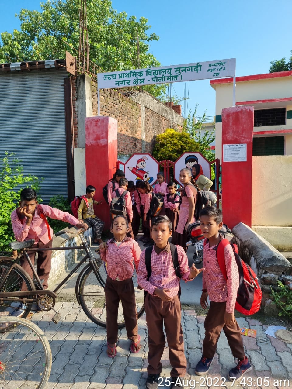 children standing at the lock gate on the school