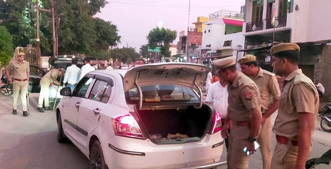 Police running in search of Aditya from the streets of the village to the fields