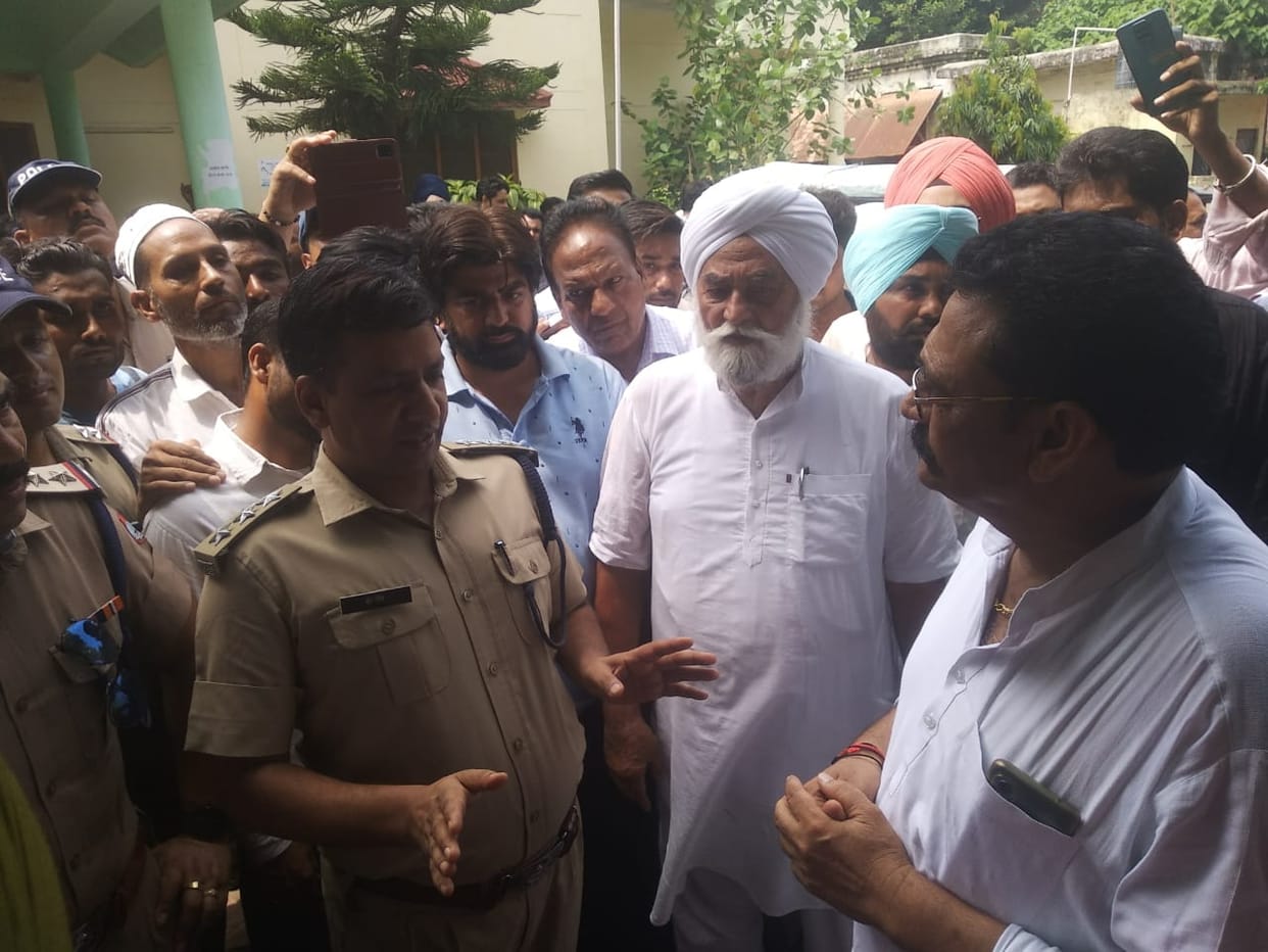 MLA Adesh Chauhan and supporters staged a sit-in protest in Kotwali