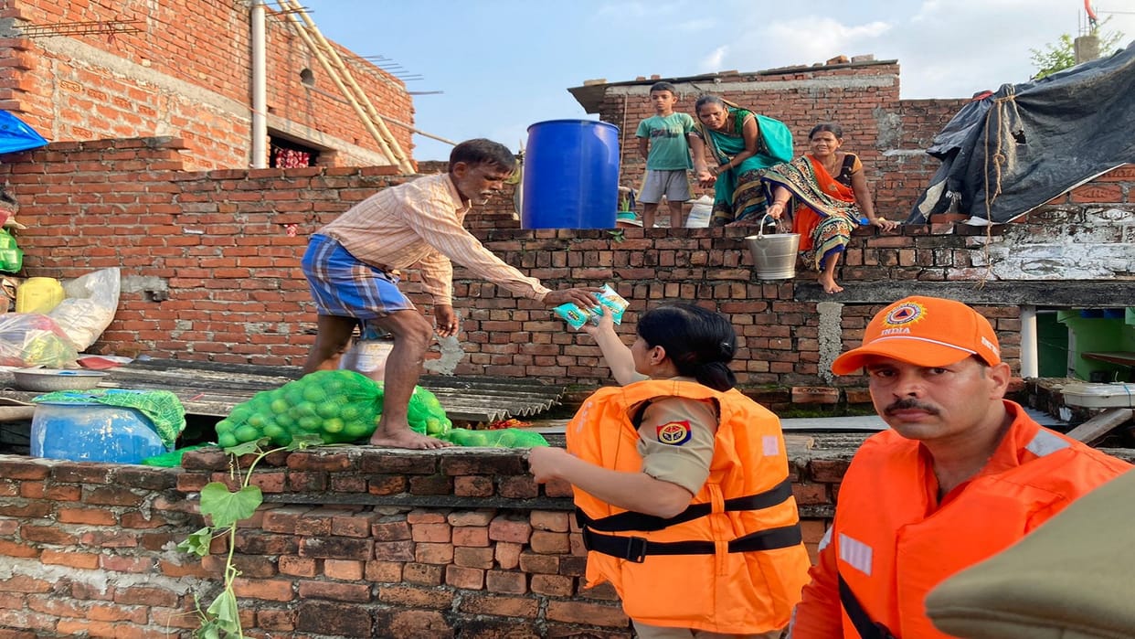 DCP Varuna distributed milk medicines and water among the flood victims in varanasi