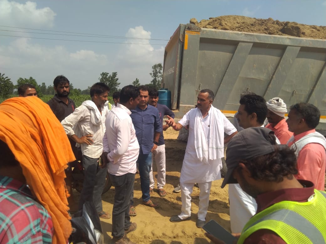 Farmers stopped highway construction to get stock of soil
