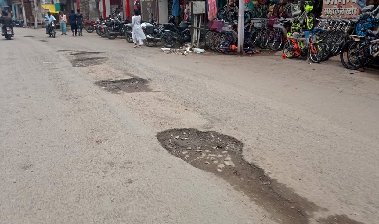 People hiccuping on the potholed roads of the city