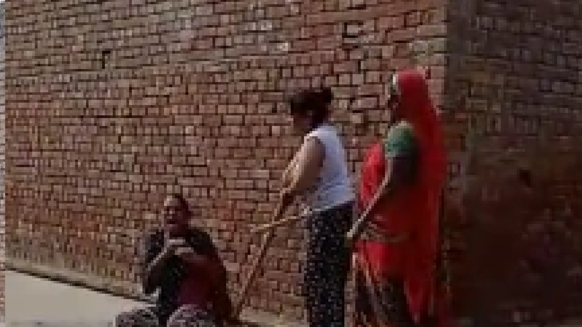 mother and daughter beat girl on road abused her and filled her mouth with mud In Sambhal