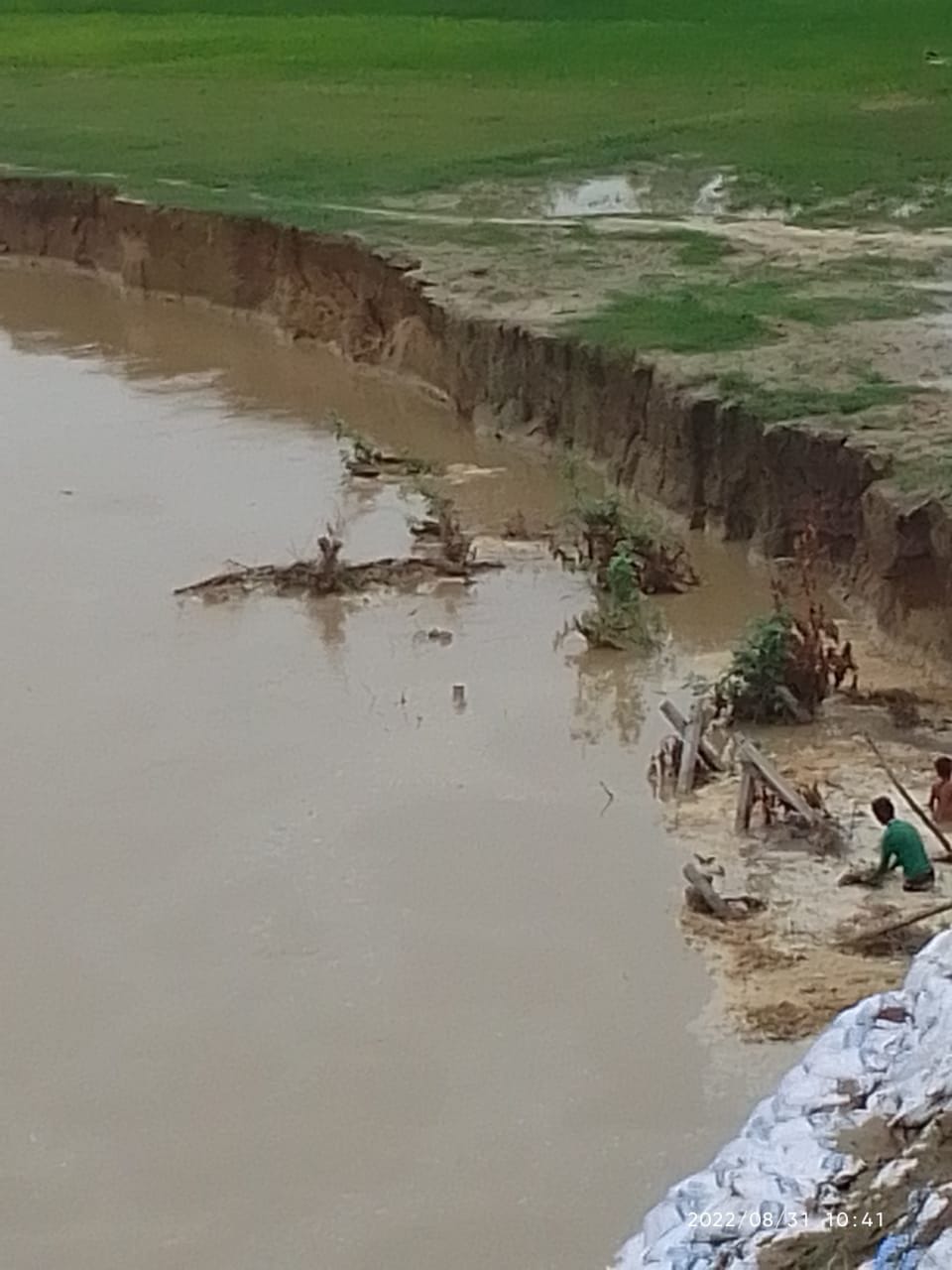 Cement poles washed away in river increased risk of flood