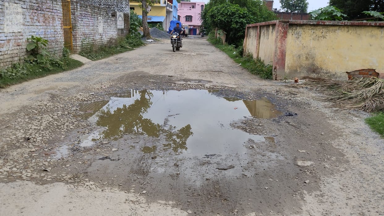 The road leading to the railway station turned into potholes