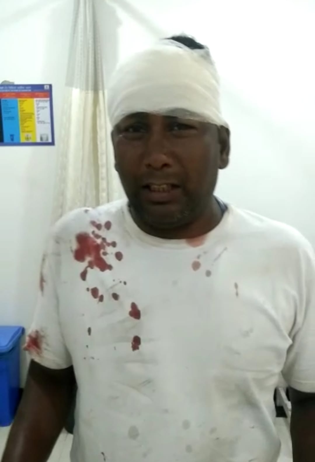 When the moving bike was stopped by hitting the hand, the driver got injured due to loss of balance, 7 stitches in the head