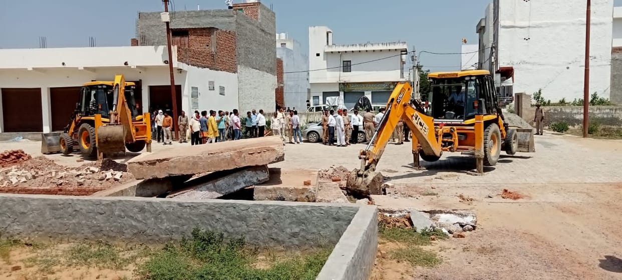 Bulldozer run on the diversion of the river made by the chairman