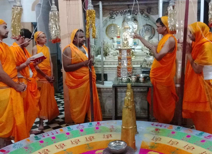 Devotees Worship Uttam Satya Dharma