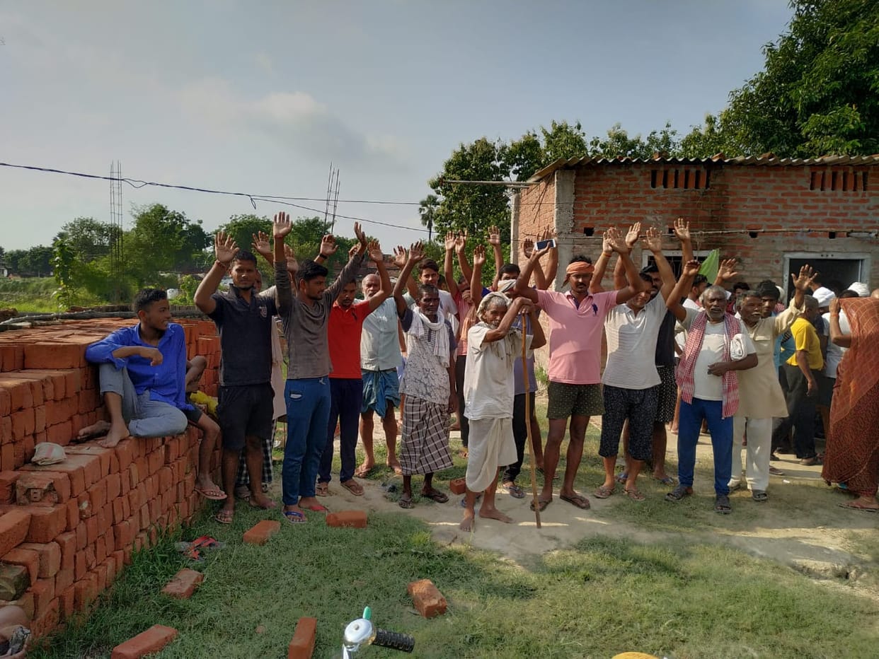 Angry villagers protest at the shop