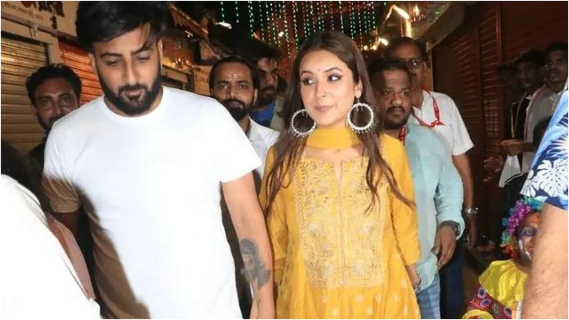 shehnaaz gill seeks blessings in lalbaugcha raja in yellow silk anarkali kurta