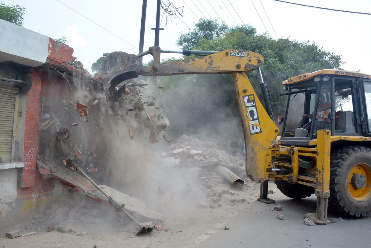 Bulldozers run on 10 shops