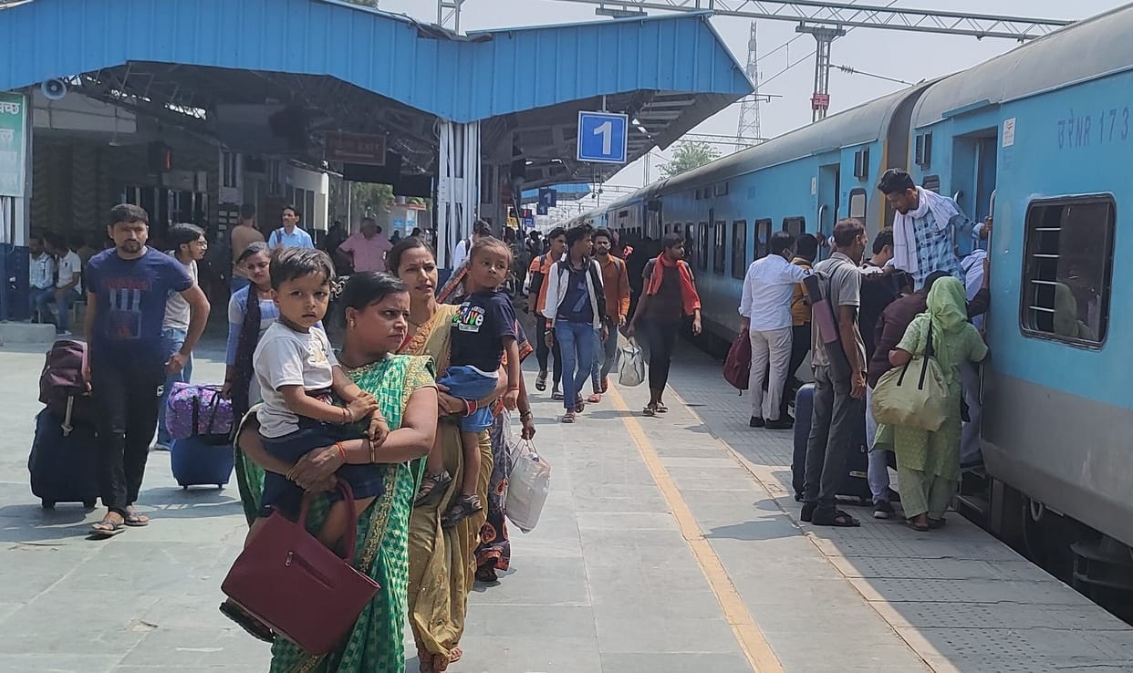 Crowd of passengers at railway station, no space found in trains
