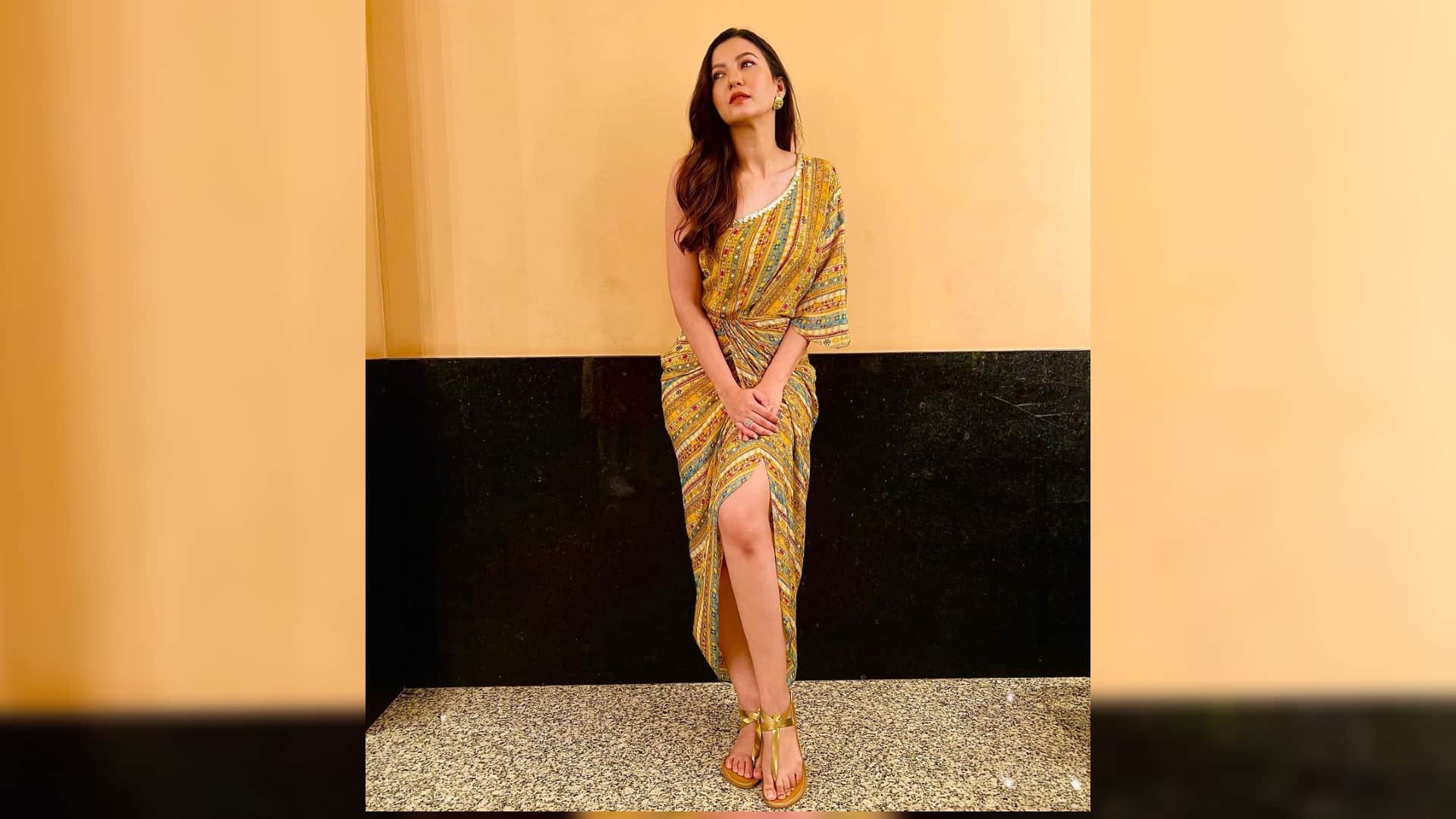 gauhar khan wear thigh high slit yellow printed dress looking gorgeous